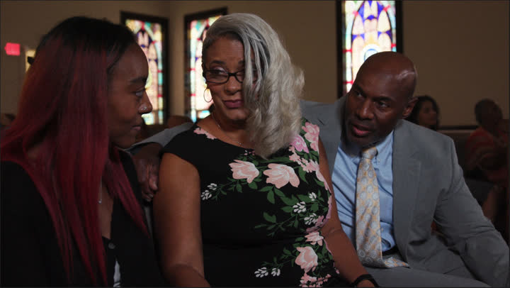 Pastor Green and Sophia console Charity